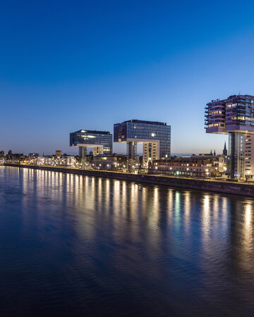 Crane Houses in Cologne’s Rheinauhafen district along the Rhine at dusk.